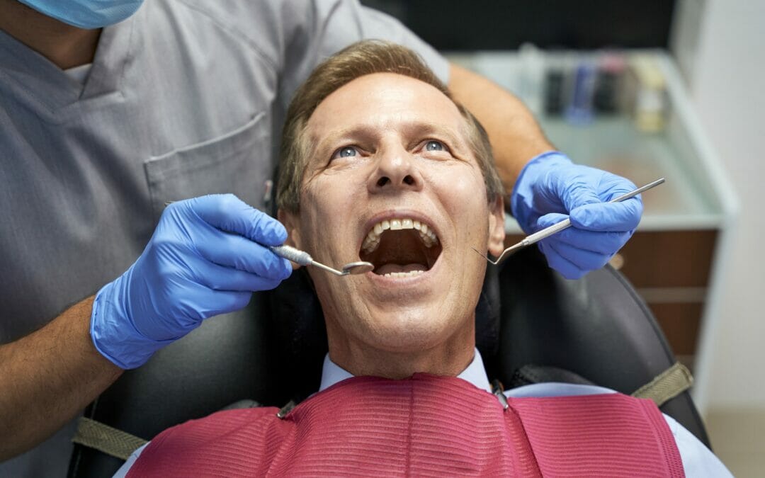 Middle-aged man with his open mouth at dentist check-up