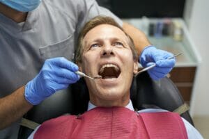 Middle-aged man with his open mouth at dentist check-up